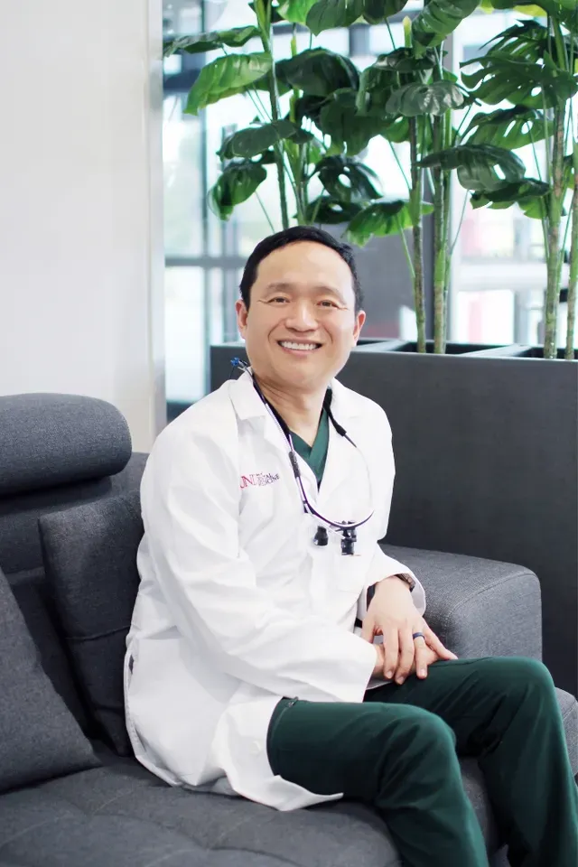 Dr. Hanbit Chi, DDS of WA Dental sitting on the couch - Dentist Federal Way WA Dr. Hanbit Chi, DDS of WA Dental sitting on the couch - Dentist Federal Way WA