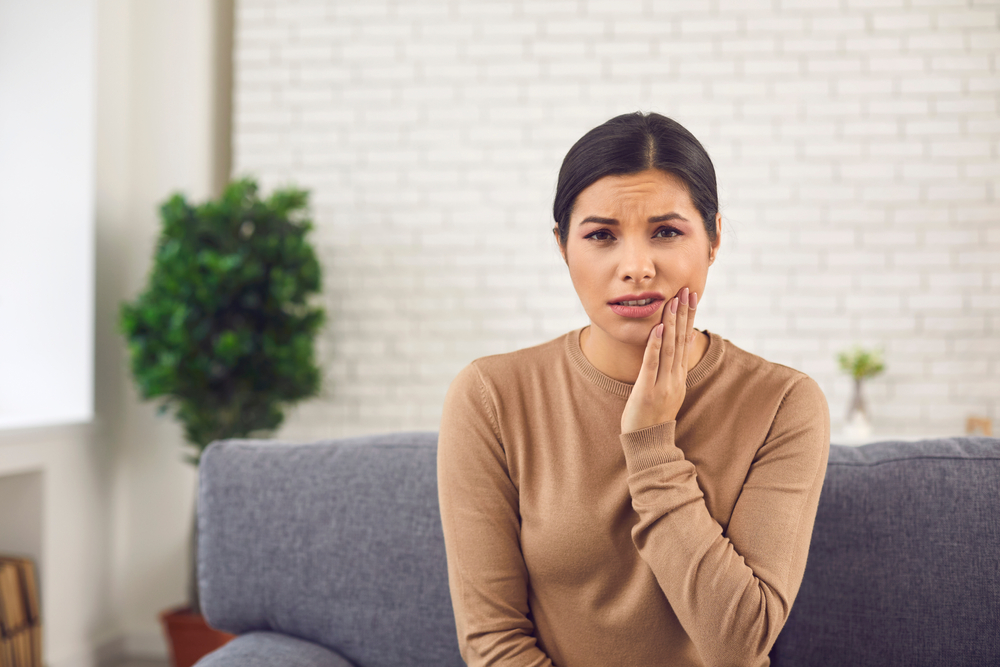 Portrait of young woman with acute toothache - emergency dentistry Portrait of young woman with acute toothache - emergency dentistry