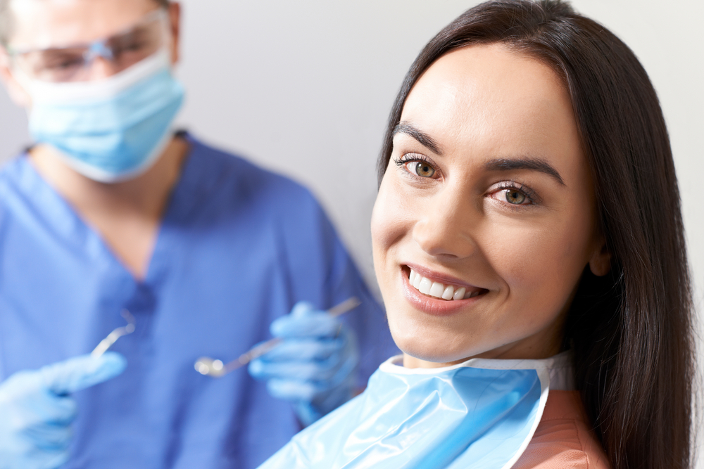 Woman at the dentist - Dental Cleanings & Check-ups Woman at the dentist - Dental Cleanings & Check-ups