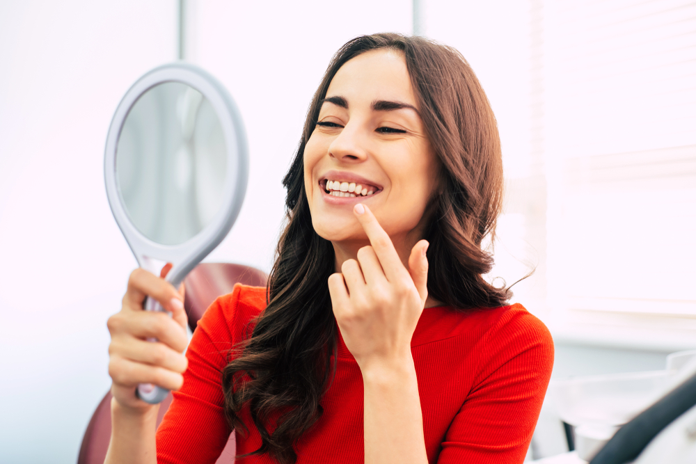 Woman checking her teeth - Invisalign in Federal Way